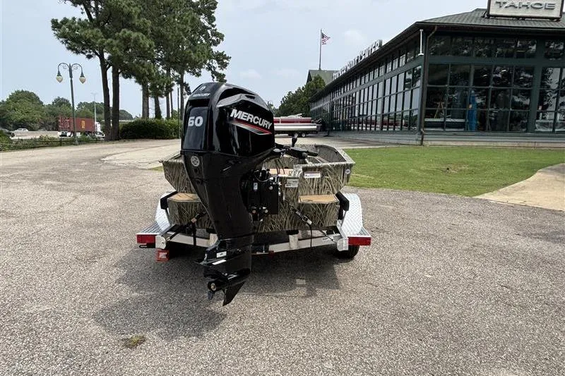 Slide: The Image of 2026 Tracker Grizzly 1756 T Marsh boat with Mercury engine on trailer. - 2