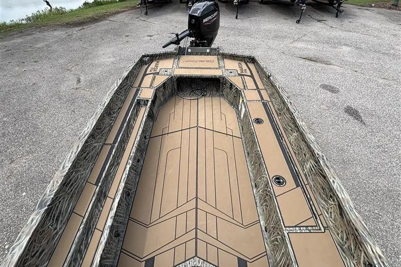 Slide: The Image of 2026 Tracker Grizzly 1756 T Marsh boat with camo interior and Mercury outboard motor. - 16