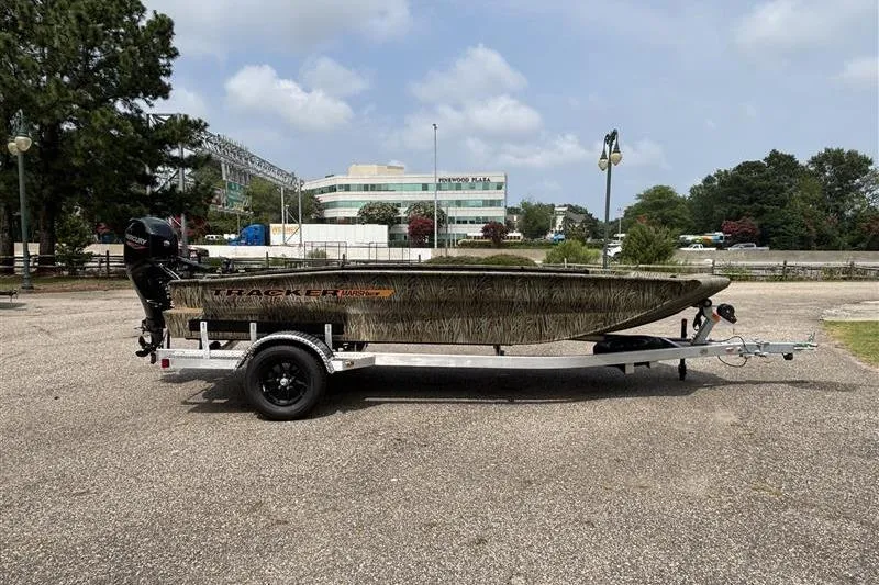 Slide: The Image of 2026 Tracker Grizzly 1756 T Marsh boat on trailer in parking lot. - 3