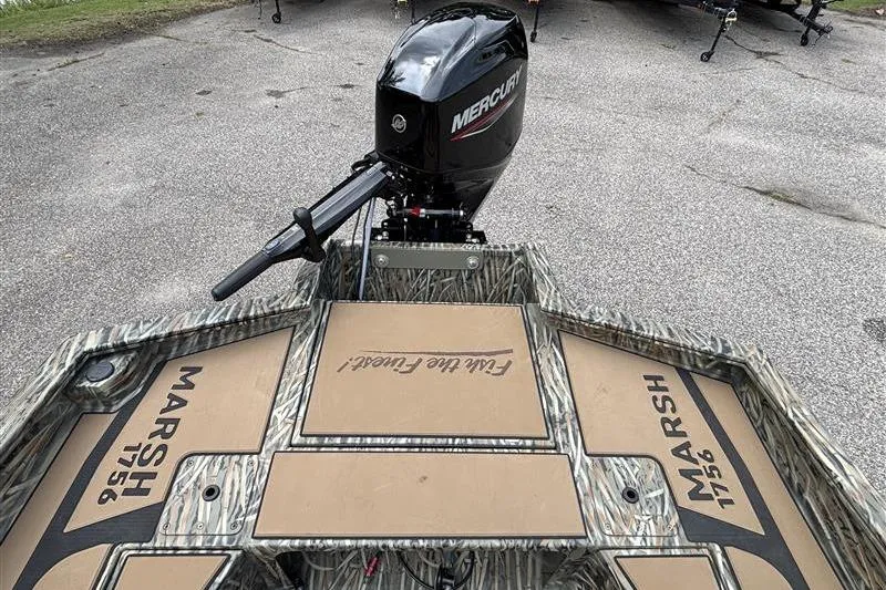 Slide: The Image of 2026 Tracker Grizzly 1756 T Marsh boat with Mercury engine, camo design. - 15