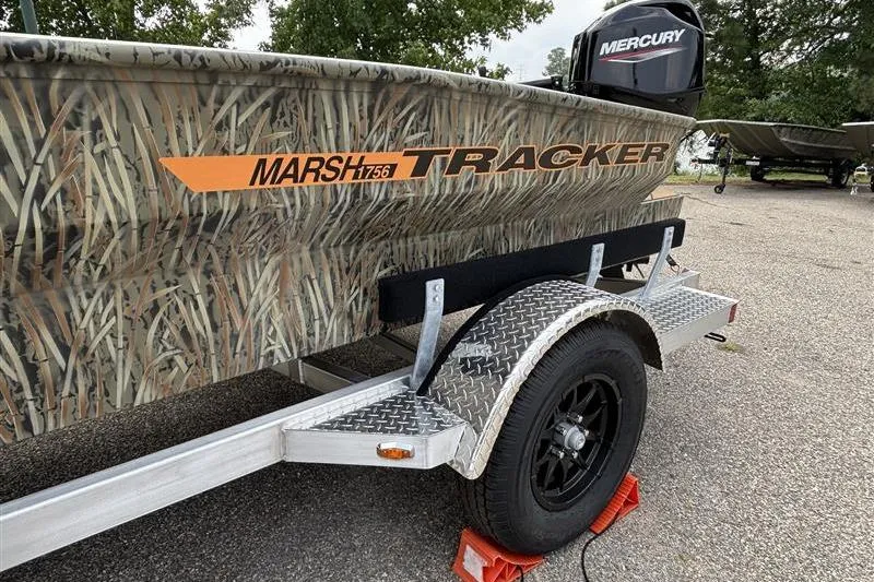 Slide: The Image of 2026 Tracker Grizzly 1756 T Marsh boat on trailer with camouflage design and Mercury engine. - 5