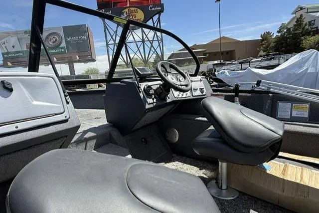 Slide: The Image of 2025 Tracker Pro Guide V-175 WT boat interior with steering wheel and seating. - 7