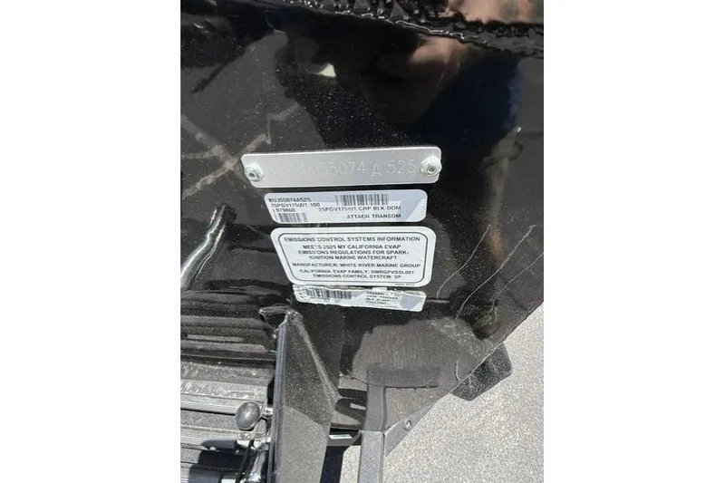 Slide: The Image of 2025 Tracker Pro Guide V-175 WT boat identification and emissions control labels. - 11