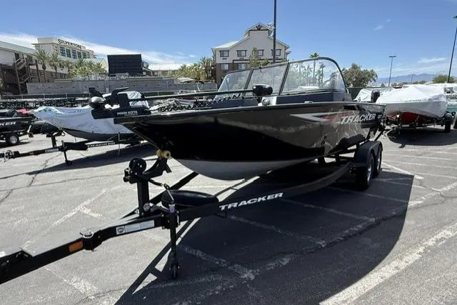 The Image of 2025 Tracker Pro Guide V-175 WT boat on trailer in parking lot. - 0