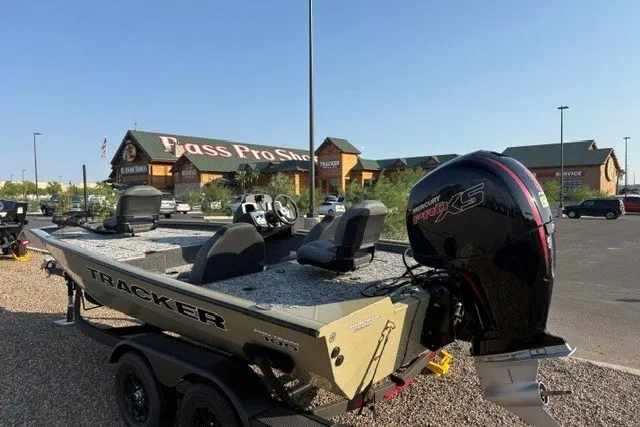 The Image of 2026 Tracker Pro Team 195 boat with motor, parked outside Bass Pro Shops. - 0