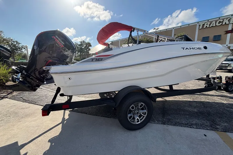 Slide: The Image of 2026 Tahoe T18 boat on trailer, featuring sleek design and powerful outboard motor. - 5