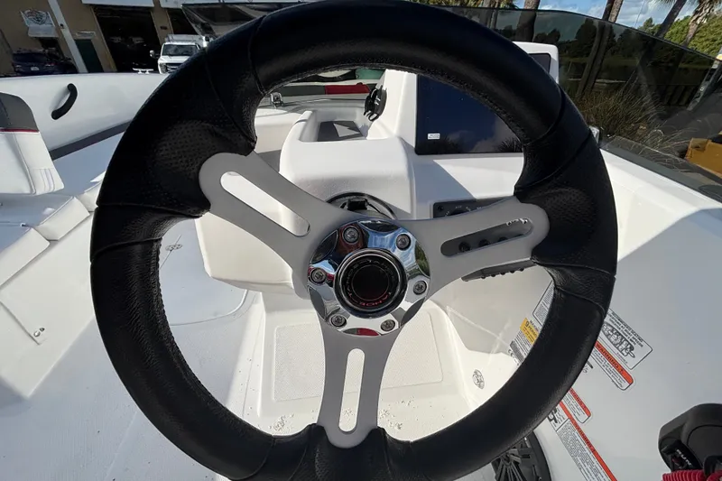 Slide: The Image of Steering wheel of 2026 Tahoe T18 boat, featuring sleek design and modern controls. - 10