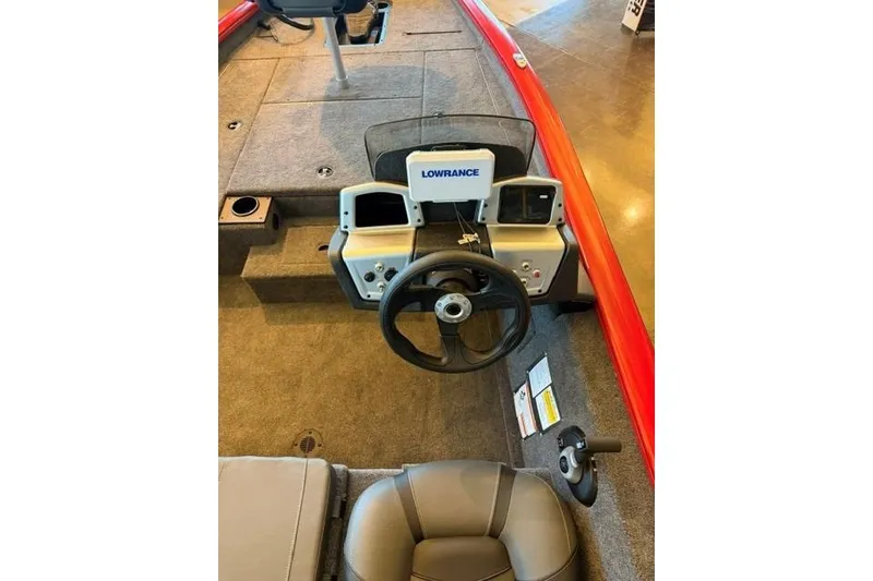 Slide: The Image of 2026 Tracker Pro Team 175 boat interior with steering wheel and Lowrance electronics. - 8