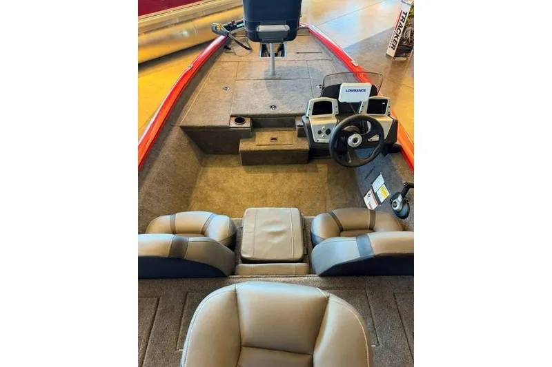 Slide: The Image of 2026 Tracker Pro Team 175 boat interior with steering console and seating. - 9