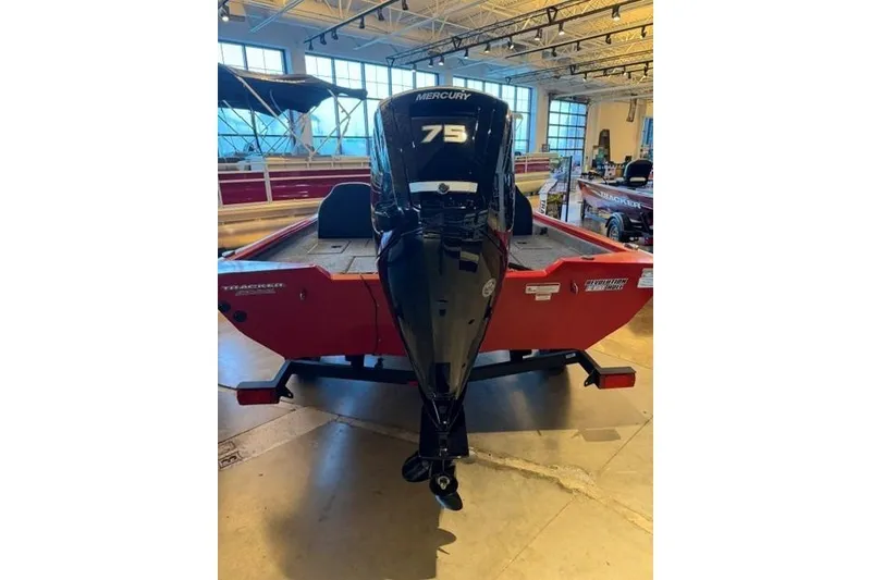 Slide: The Image of 2026 Tracker Pro Team 175 boat with Mercury 75 engine in showroom. - 4