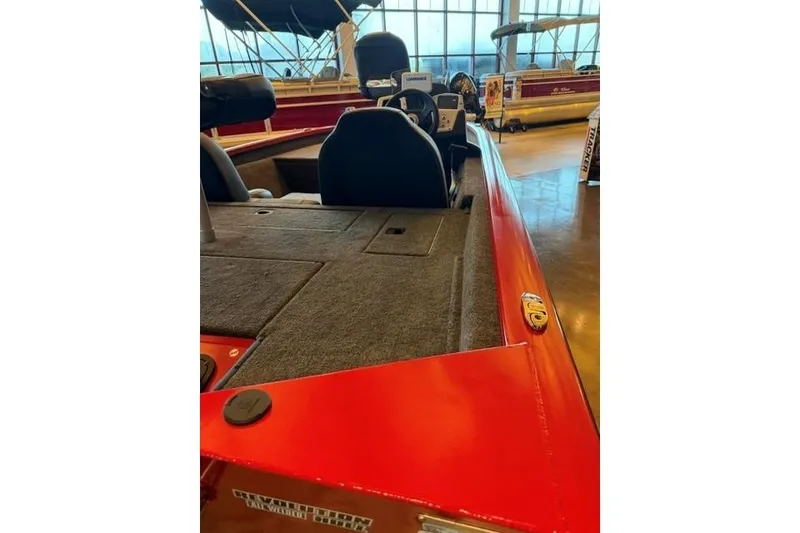 Slide: The Image of 2026 Tracker Pro Team 175 boat interior with red trim and carpeted deck. - 5