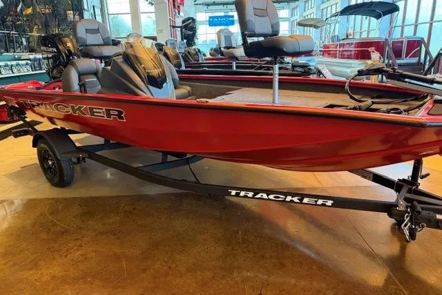 Slide: The Image of 2026 Tracker Pro Team 175 boat in showroom, featuring red exterior and comfortable seating. - 3