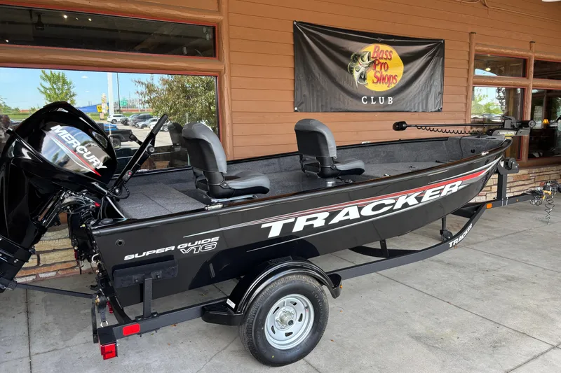Slide: The Image of 2026 Tracker Super Guide V-16 T boat displayed at Bass Pro Shops. - 2