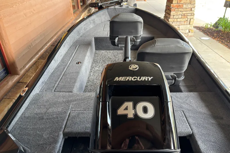 Slide: The Image of 2026 Tracker Super Guide V-16 T boat with Mercury 40 engine, interior view. - 4