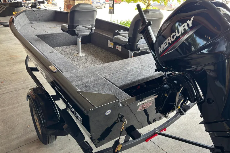 Slide: The Image of 2026 Tracker Super Guide V-16 T boat with Mercury engine on trailer. - 5