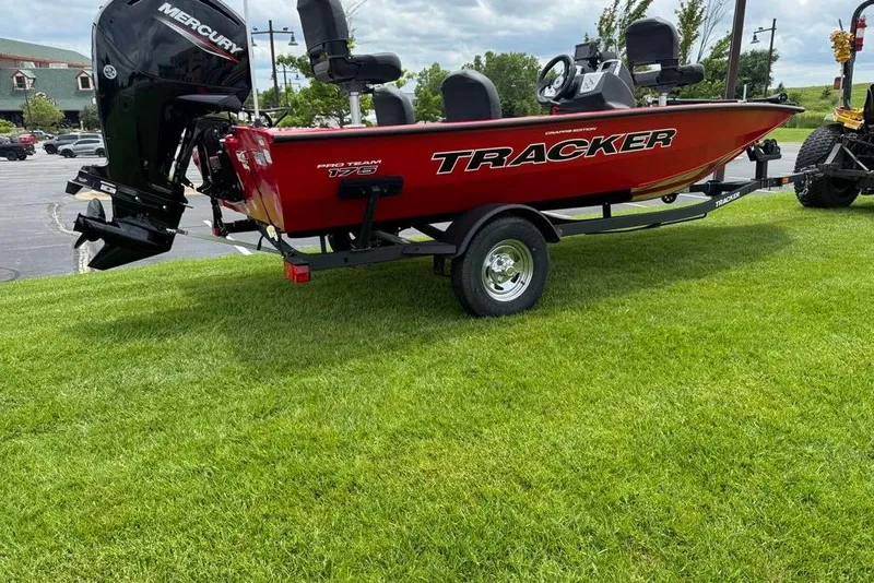 The Image of 2026 Tracker Pro Team 175 Crappie Edition boat on trailer, parked on grass. - 0