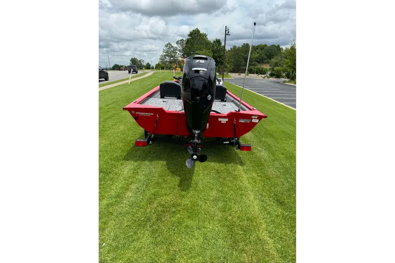 Slide: The Image of Red 2026 Tracker Pro Team 175 Crappie Edition boat on grass, rear view. - 7