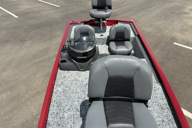Slide: The Image of 2026 Tracker Pro 170 boat interior with gray seating and red trim. - 19