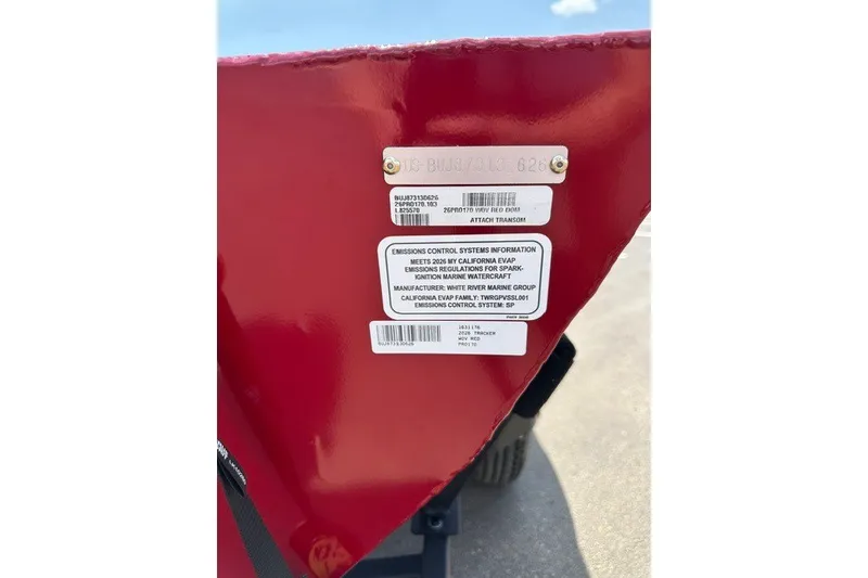 Slide: The Image of Red Tracker Pro 170 boat transom with emissions control labels, 2026 model. - 81