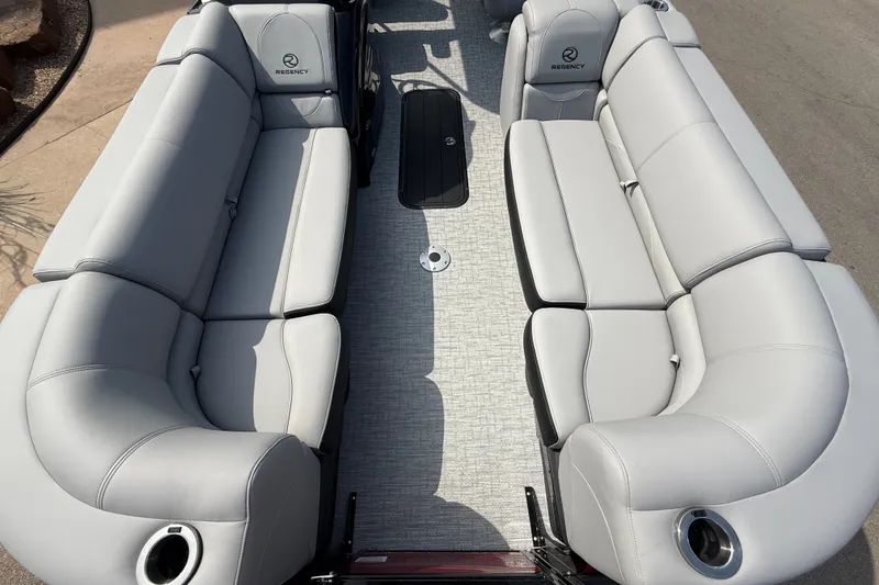 Slide: The Image of Luxurious seating on 2026 Regency 230 DL pontoon boat, featuring sleek gray upholstery. - 12