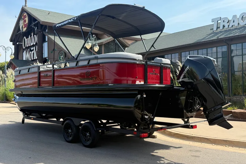 Slide: The Image of 2026 Regency 230 DL pontoon boat with Mercury engine, parked outside Outdoor World. - 3