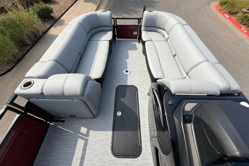 Slide: The Image of Spacious interior of 2026 Regency 230 DL pontoon boat with plush seating. - 11