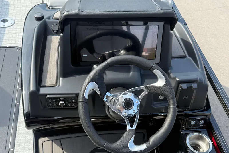 Slide: The Image of Steering console of 2026 Regency 230 DL boat with modern controls and touchscreen display. - 9