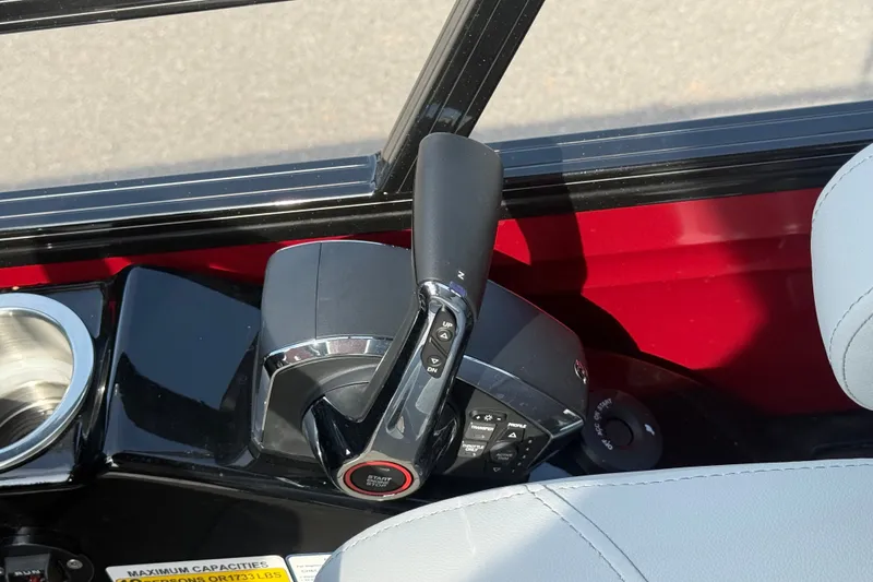 Slide: The Image of Throttle control of 2026 Regency 230 DL boat, featuring sleek design and modern controls. - 10
