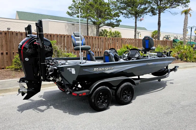 The Image of 2026 Ranger RT188P fishing boat with dual seats and powerful outboard motor. - 0