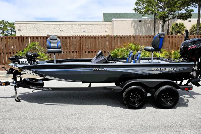 Slide: The Image of 2026 Ranger RT188P fishing boat on trailer, parked outdoors. - 10