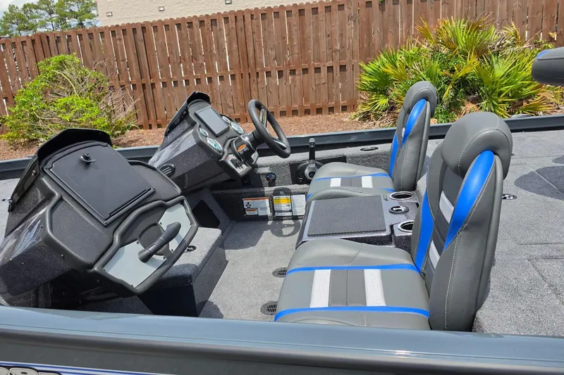 Slide: The Image of 2026 Ranger RT188P boat interior with dual consoles and blue-accented seats. - 12