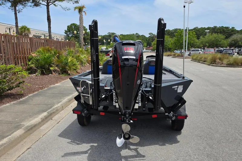 Slide: The Image of 2026 Ranger RT188P boat with Mercury 115 engine, parked on a sunny street. - 6