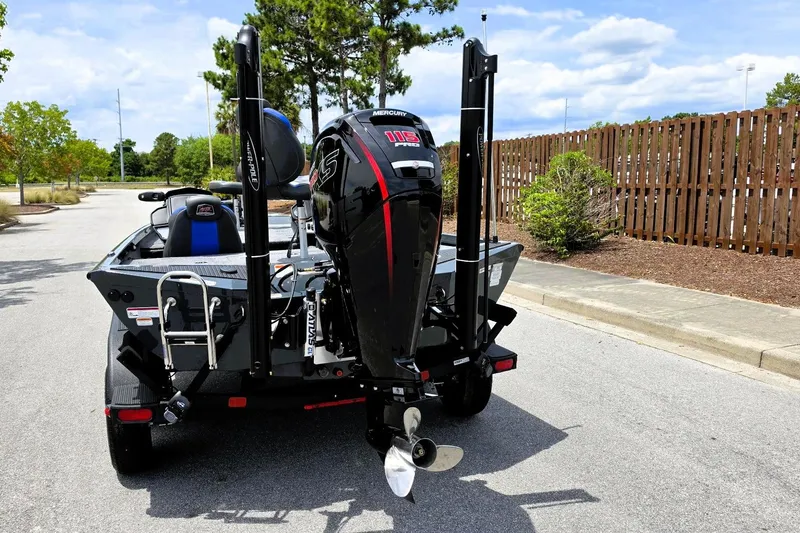 Slide: The Image of 2026 Ranger RT188P boat with powerful outboard motor on a sunny day. - 9