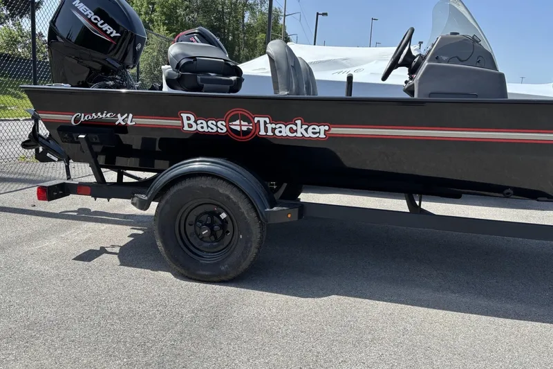 The Image of 2026 Tracker Bass Tracker Classic XL boat on trailer, featuring Mercury engine. - 0
