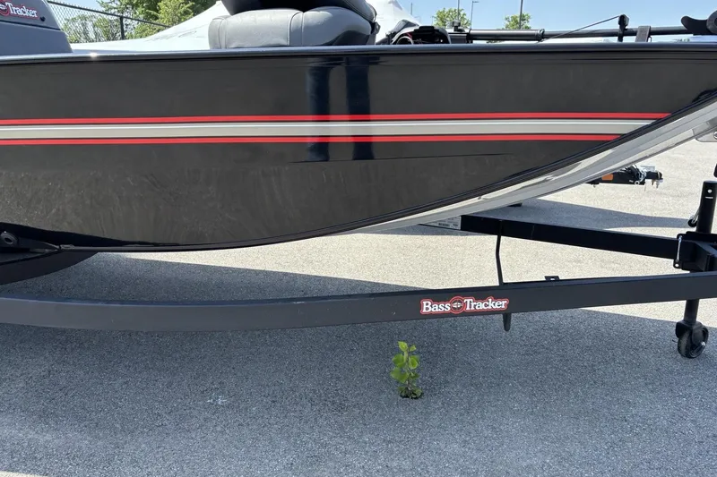 Slide: The Image of 2026 Tracker Bass Tracker Classic XL boat on trailer, parked on pavement. - 4