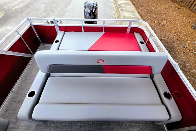 Slide: The Image of 2026 Sun Tracker Party Barge 22 RF DLX with stylish seating and cup holders. - 18