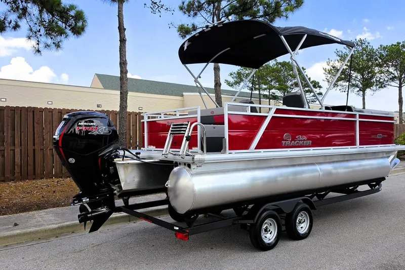 Slide: The Image of 2026 Sun Tracker Party Barge 22 RF DLX pontoon boat with Mercury engine on trailer. - 3