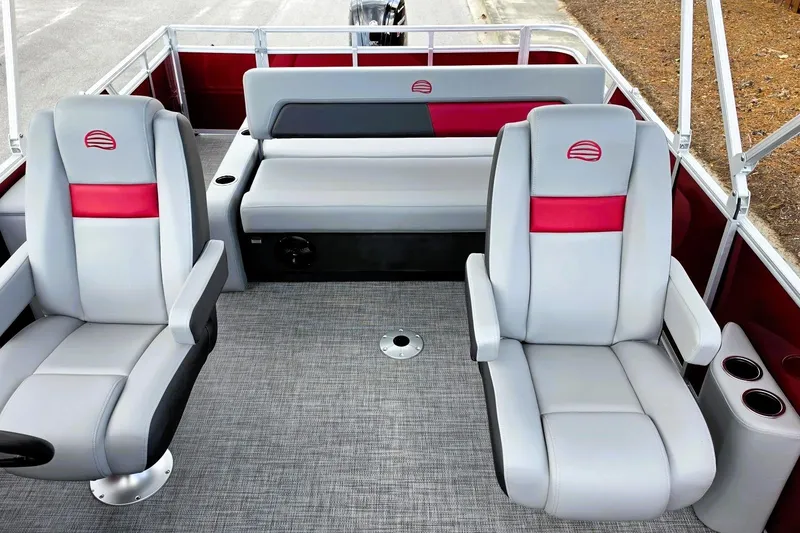 Slide: The Image of 2026 Sun Tracker Party Barge 22 RF DLX interior with plush seating and modern design. - 17