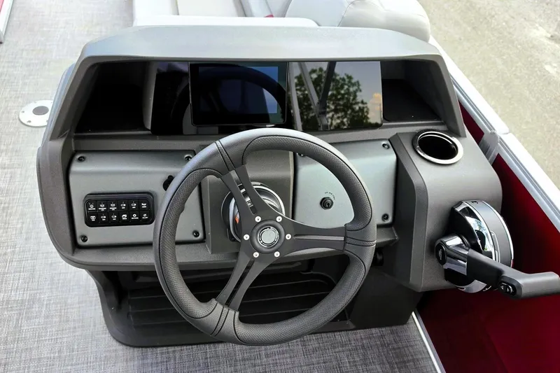 Slide: The Image of Helm of 2026 Sun Tracker Party Barge 22 RF DLX with steering wheel and controls. - 13