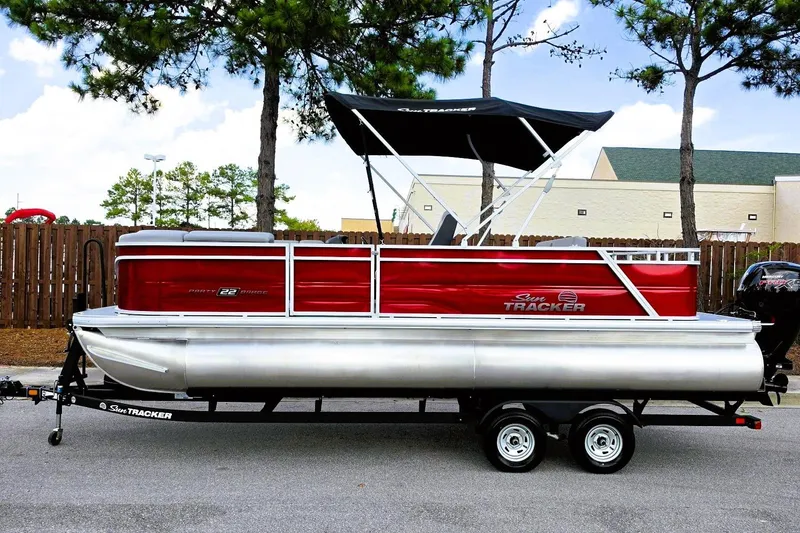 Slide: The Image of 2026 Sun Tracker Party Barge 22 RF DLX pontoon boat with canopy on trailer. - 9