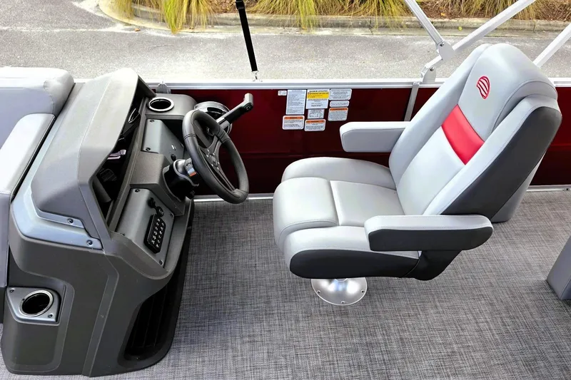 Slide: The Image of Captain's chair and helm of 2026 Sun Tracker Party Barge 22 RF DLX pontoon boat. - 14