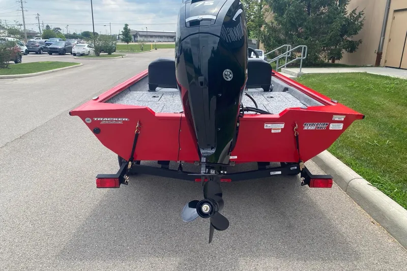 Slide: The Image of 2026 Tracker Pro Team 175 Crappie Edition boat, rear view, parked on a street. - 6