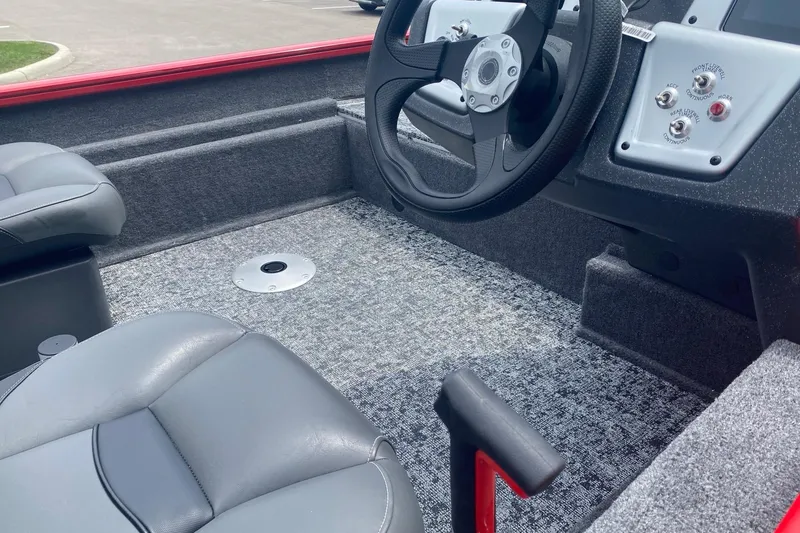 Slide: The Image of Interior of 2026 Tracker Pro Team 175 Crappie Edition boat with steering wheel and seats. - 4