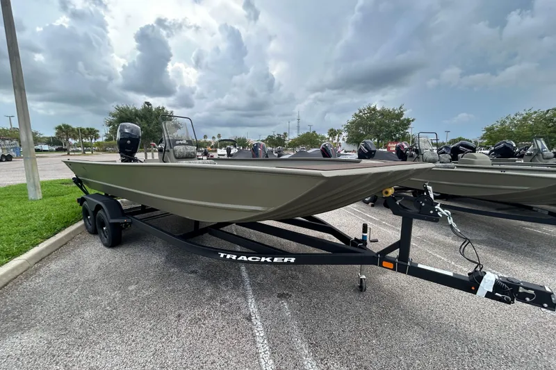 Slide: The Image of 2026 Tracker Grizzly 2072 CC boat on trailer under cloudy sky. - 4