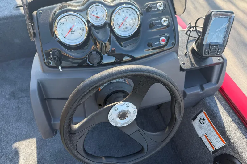 Slide: The Image of Steering console of 2026 Tracker Pro 170 boat with gauges and Garmin device. - 3