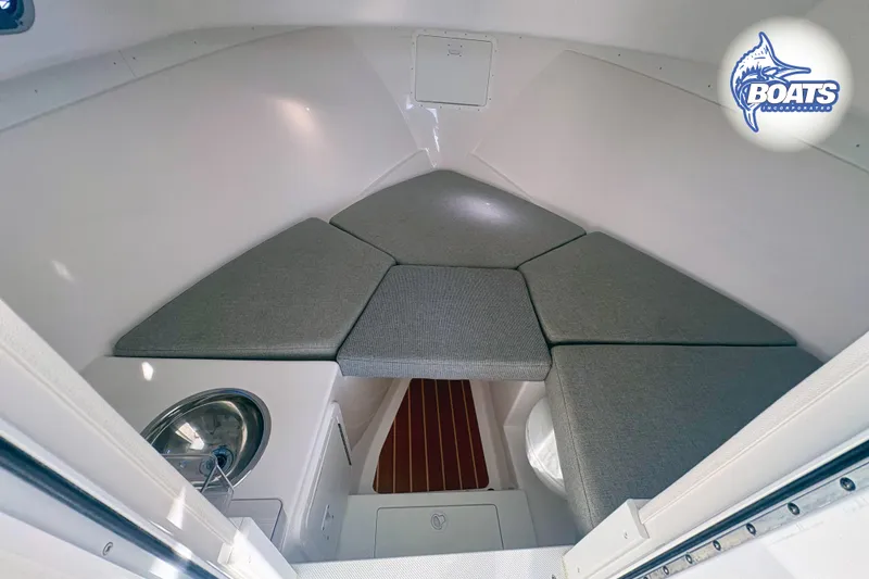 Slide: The Image of Interior cabin of 2022 Steiger Craft 28 Miami boat with cushioned seating. - 14