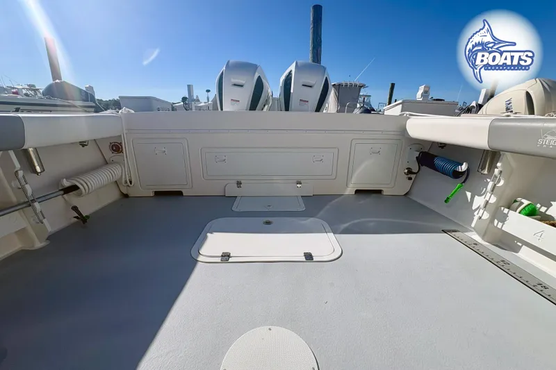 Slide: The Image of Interior view of 2022 Steiger Craft 28 Miami boat, showcasing spacious deck and storage compartments. - 18