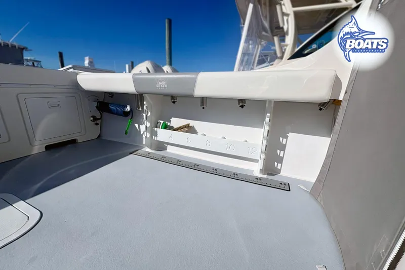 Slide: The Image of 2022 Steiger Craft 28 Miami boat interior with fishing rod holders and measuring ruler. - 19