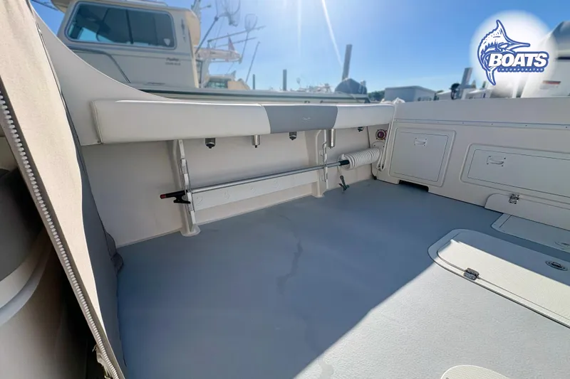 Slide: The Image of 2022 Steiger Craft 28 Miami boat interior with storage compartments and seating. - 20