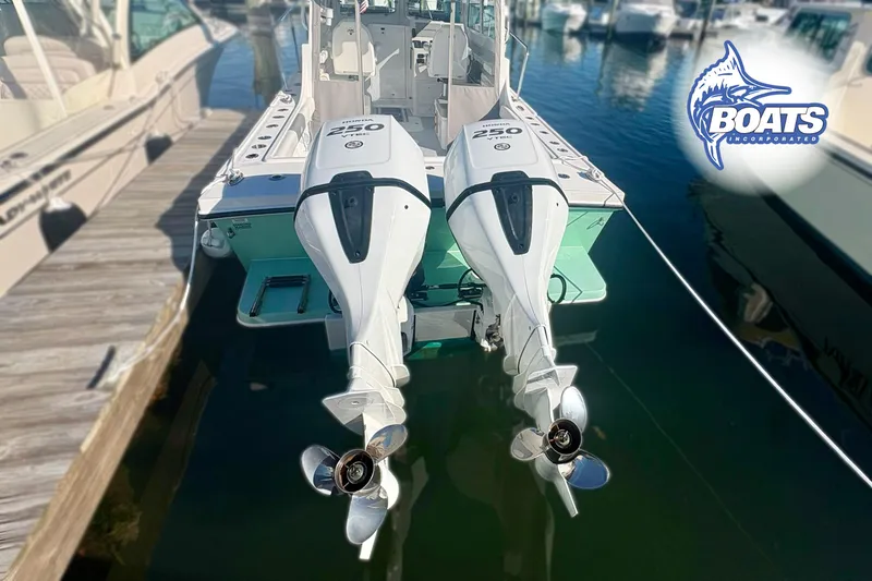 Slide: The Image of 2022 Steiger Craft 28 Miami boat with twin 250 horsepower engines docked at marina. - 21